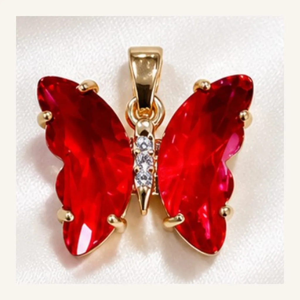 Dije de Acero Mariposa de Cristal Rojo