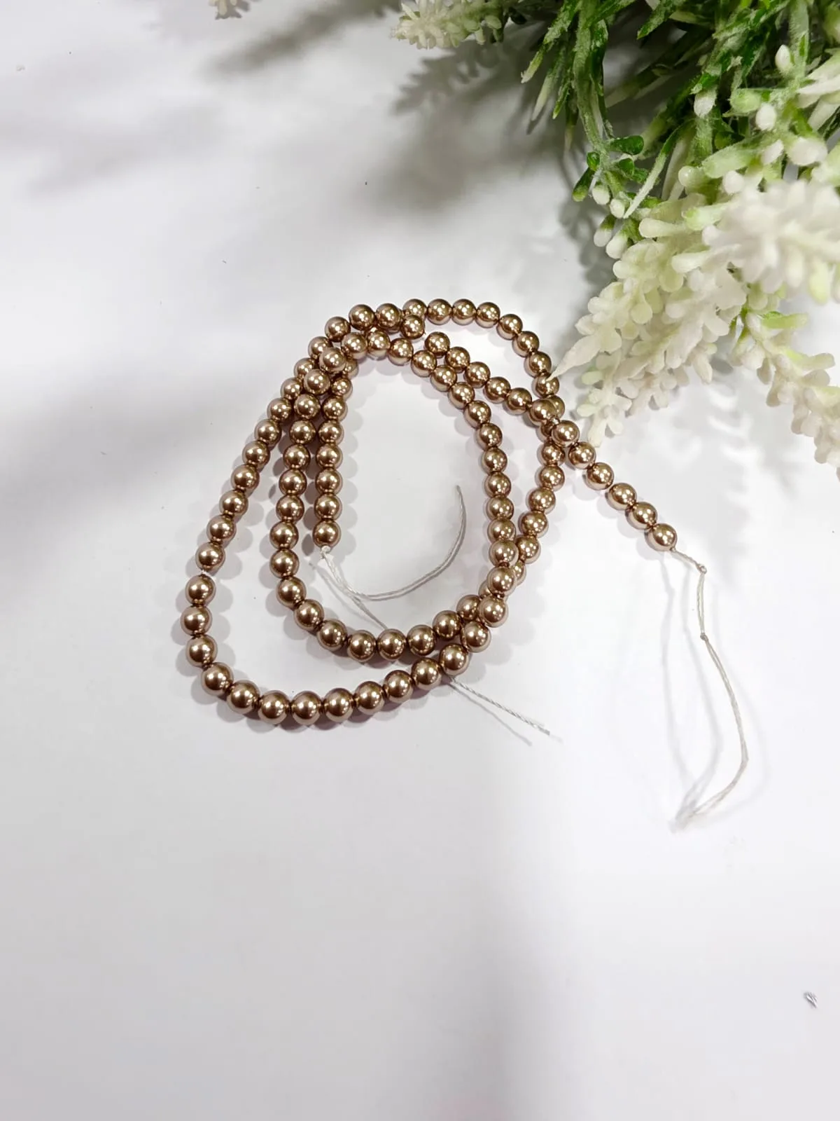 Perlas Shell 4mm Bronce