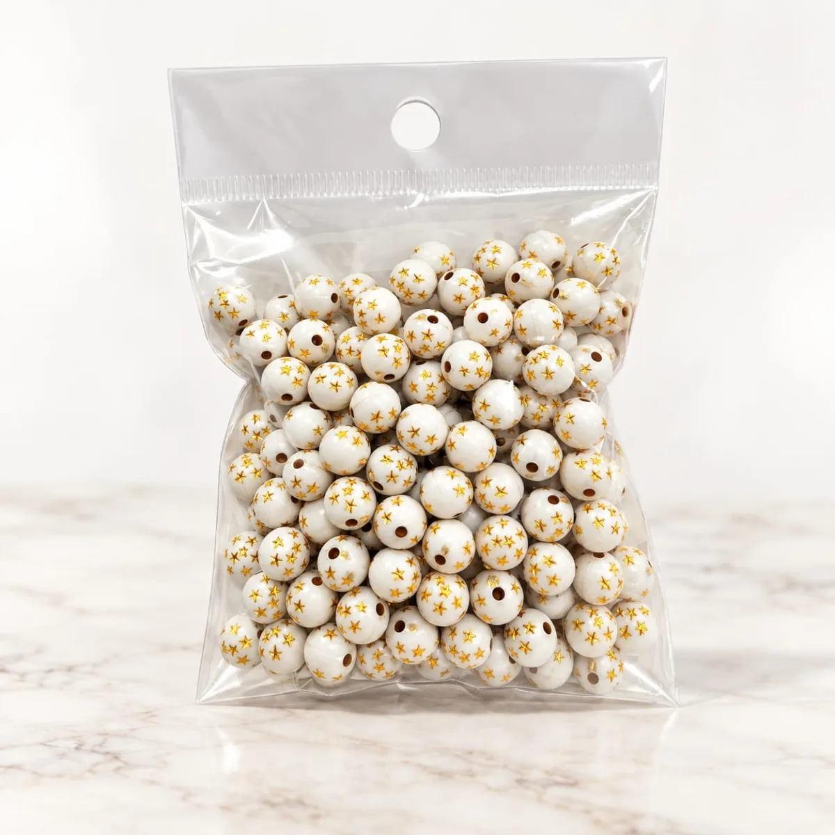 Cuentas Acrílicas Blanco con Estrellas y Puntos Dorados 8 mm