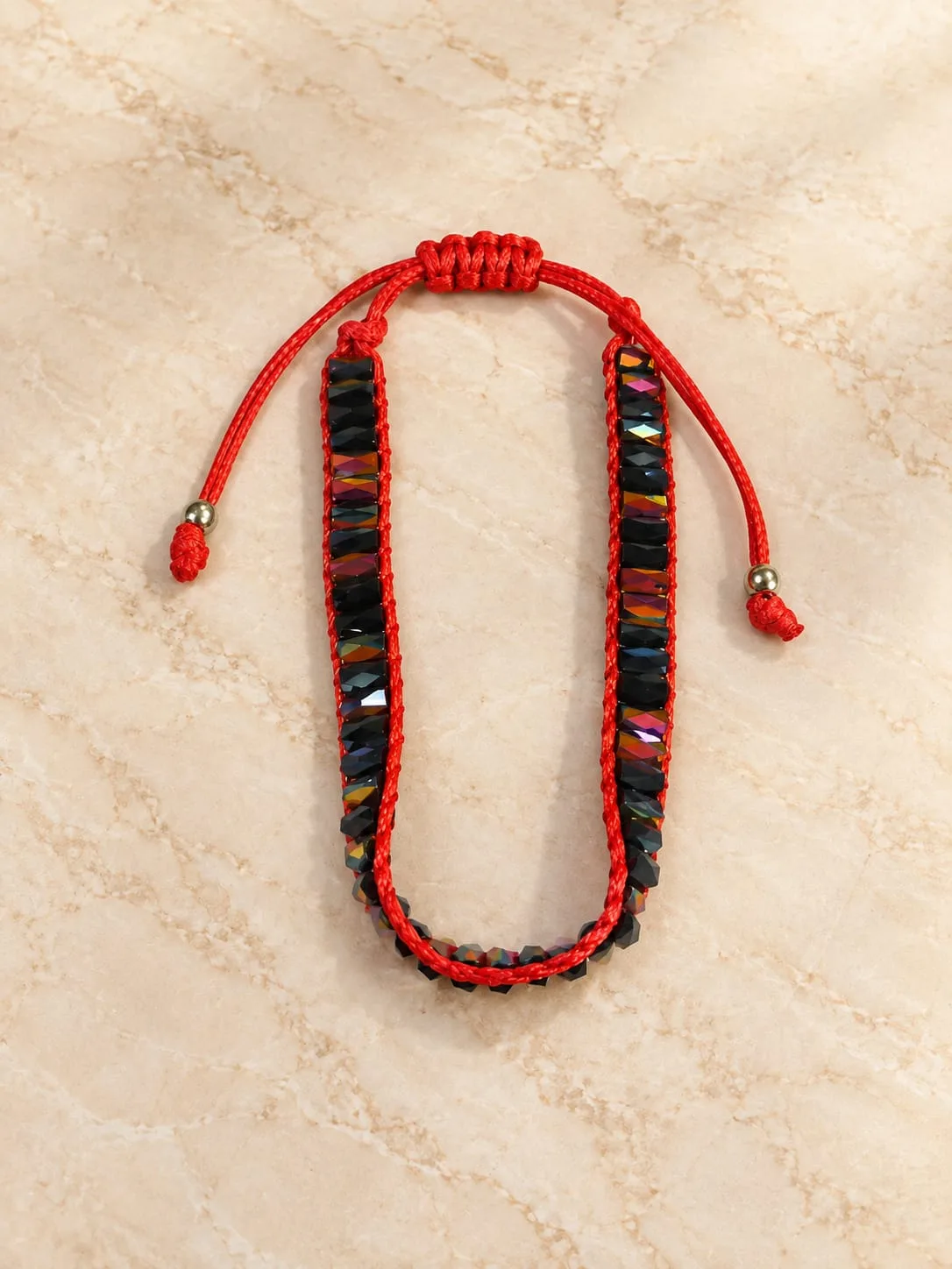 Pulsera de Cristal Negro Iridiscente con Hilo Rojo
